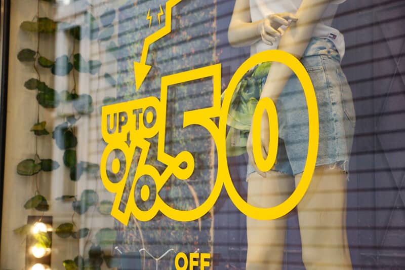 An image of sale signage as a window graphic.